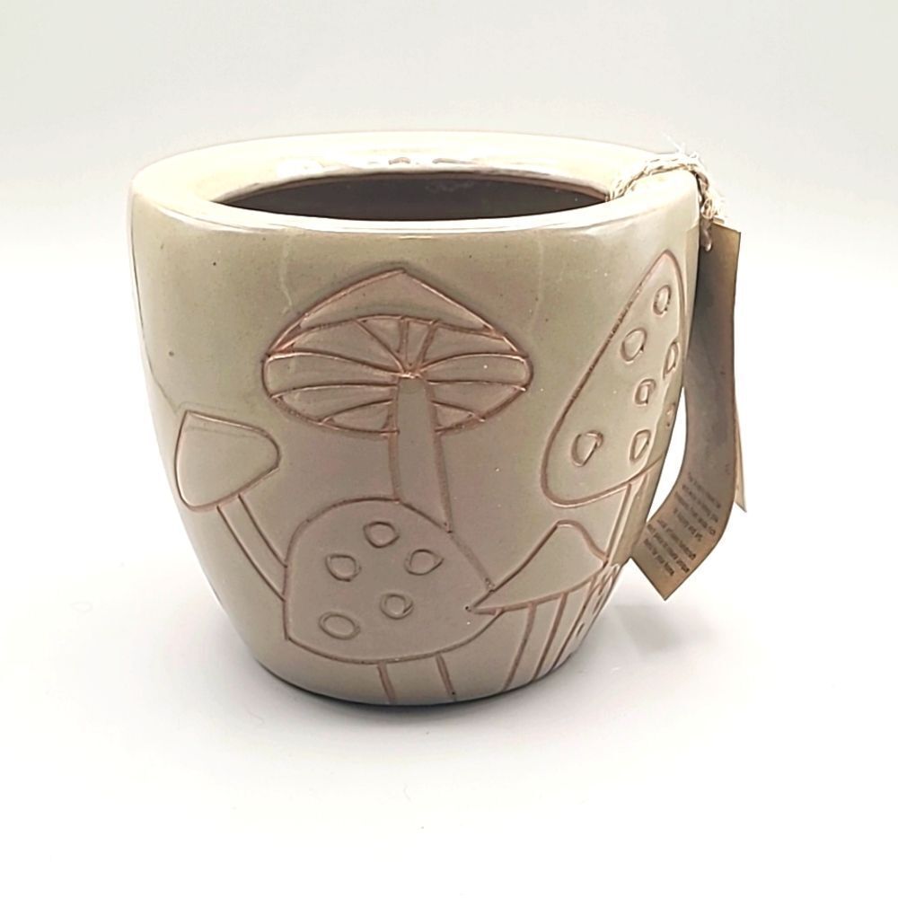 Tan Planter with Mushrooms Carved on the Outside in Dark Brown
